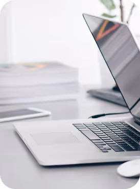 An open laptop on a clean white desk